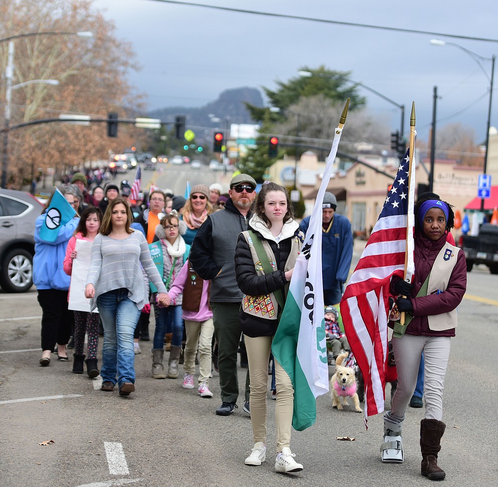 Several hundred people, young, old, male, female and of different racial backgrounds braved the cold, freezing rain and wind to march in the annual Martin Luther King Jr. Peace and Justice march through the downtown area Monday Jan. 21, 2019 in Prescott. .The march started at Prescott College down Gurley Street and around the Yavapai County Courthouse Plaza and returned to Prescott College. (Les Stukenberg/Courier).
