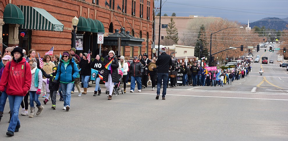 Several hundred people, young, old, male, female and of different racial backgrounds braved the cold, freezing rain and wind to march in the annual Martin Luther King Jr. Peace and Justice march through the downtown area Monday Jan. 21, 2019 in Prescott. .The march started at Prescott College down Gurley Street and around the Yavapai County Courthouse Plaza and returned to Prescott College. (Les Stukenberg/Courier).