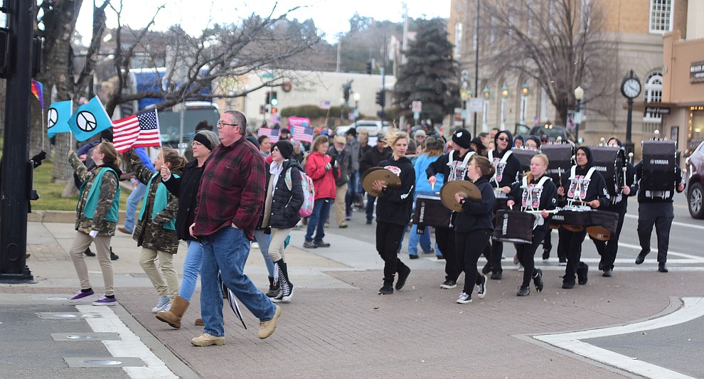Several hundred people, young, old, male, female and of different racial backgrounds braved the cold, freezing rain and wind to march in the annual Martin Luther King Jr. Peace and Justice march through the downtown area Monday Jan. 21, 2019 in Prescott. .The march started at Prescott College down Gurley Street and around the Yavapai County Courthouse Plaza and returned to Prescott College. (Les Stukenberg/Courier).