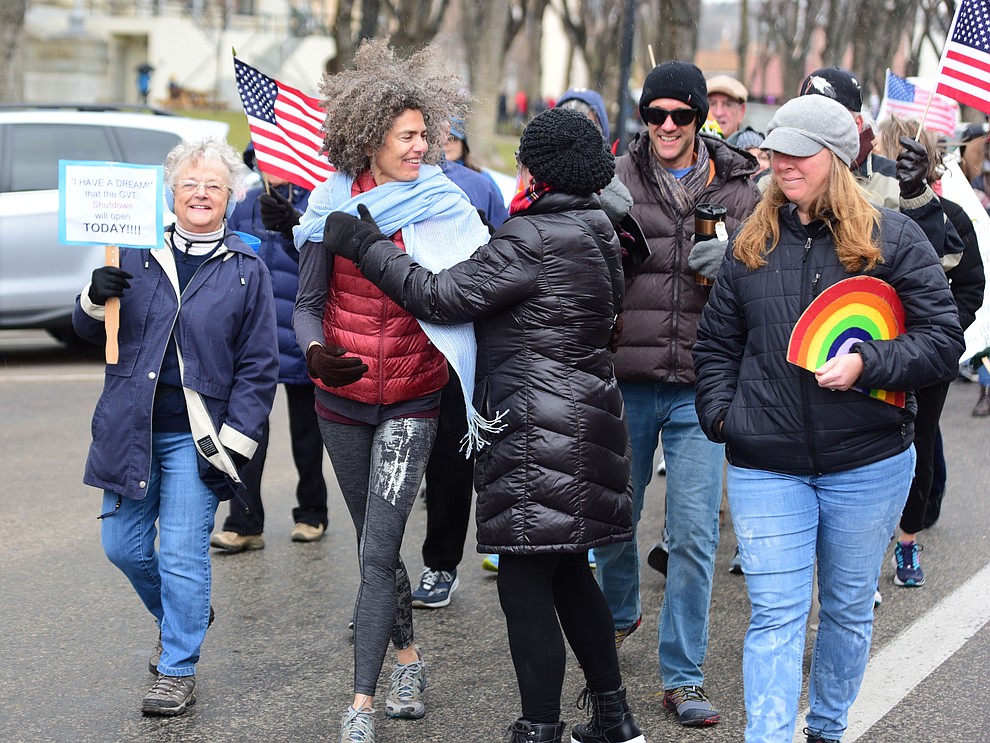 Several hundred people, young, old, male, female and of different racial backgrounds braved the cold, freezing rain and wind to march in the annual Martin Luther King Jr. Peace and Justice march through the downtown area Monday Jan. 21, 2019 in Prescott. .The march started at Prescott College down Gurley Street and around the Yavapai County Courthouse Plaza and returned to Prescott College. (Les Stukenberg/Courier).