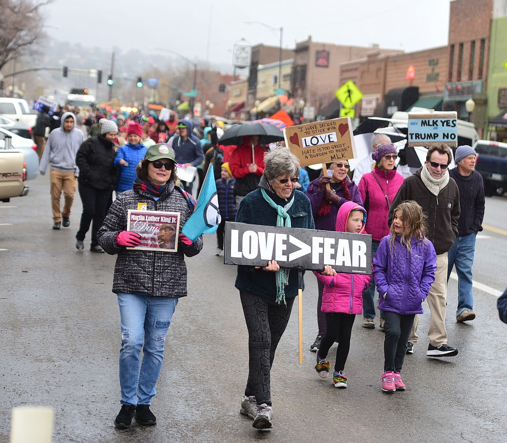 Several hundred people, young, old, male, female and of different racial backgrounds braved the cold, freezing rain and wind to march in the annual Martin Luther King Jr. Peace and Justice march through the downtown area Monday Jan. 21, 2019 in Prescott. .The march started at Prescott College down Gurley Street and around the Yavapai County Courthouse Plaza and returned to Prescott College. (Les Stukenberg/Courier).