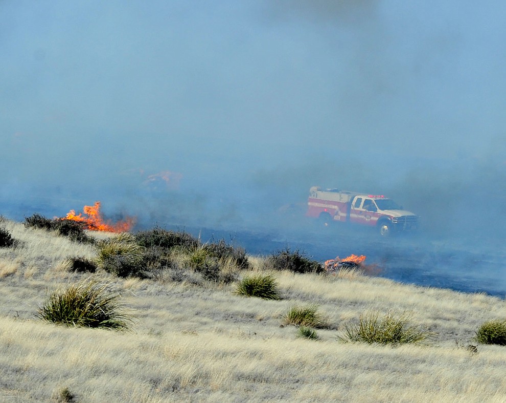 A type 6 engine from Central Arizona Fire & Medical works the interior of a fast moving wildland fire burns along the north side of Highway 89A between Glassford Hill Road and Granite Dells Parkway Monday Jan. 21, 2019 in Prescott Valley. (Les Stukenberg/Courier).