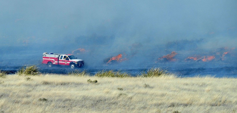 A type 6 engine from Central Arizona Fire & Medical works the interior of a fast moving wildland fire burns along the north side of Highway 89A between Glassford Hill Road and Granite Dells Parkway Monday Jan. 21, 2019 in Prescott Valley. (Les Stukenberg/Courier).