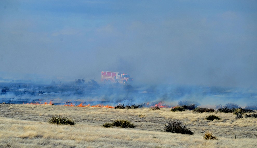 A water tender from Central Arizona Fire & Medical works the interior of a fast moving wildland fire burns along the north side of Highway 89A between Glassford Hill Road and Granite Dells Parkway Monday Jan. 21, 2019 in Prescott Valley. (Les Stukenberg/Courier).