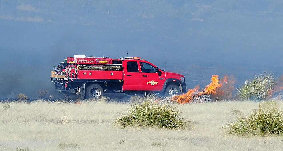 A type 6 engine from Prescott Fire works the interior of a fast moving wildland fire burns along the north side of Highway 89A between Glassford Hill Road and Granite Dells Parkway Monday Jan. 21, 2019 in Prescott Valley. (Les Stukenberg/Courier).