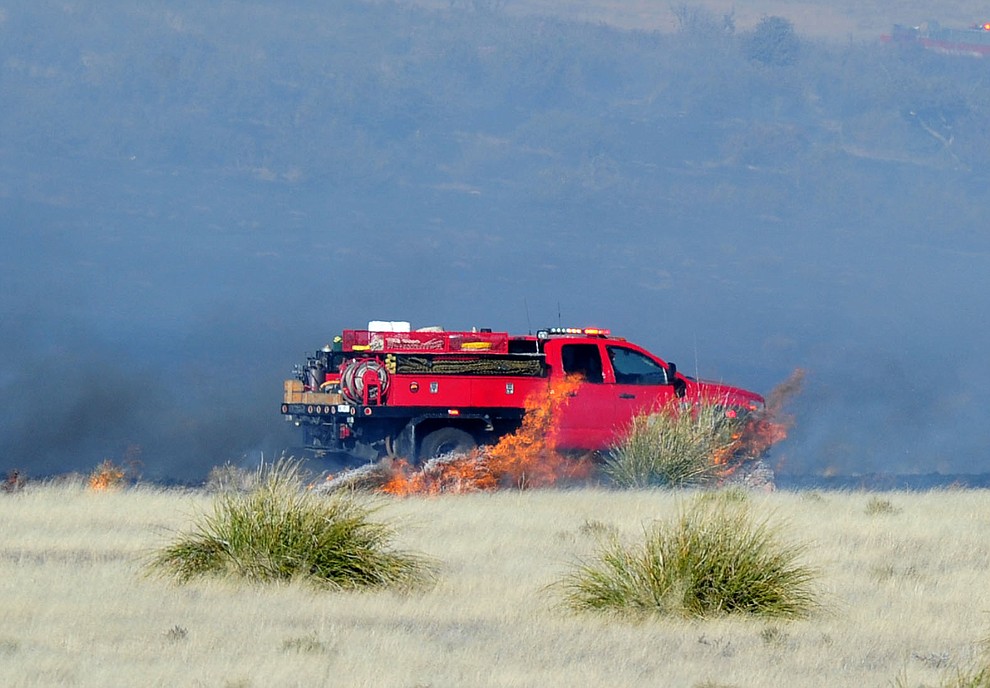 A type 6 engine from Prescott Fire works the interior of a fast moving wildland fire burns along the north side of Highway 89A between Glassford Hill Road and Granite Dells Parkway Monday Jan. 21, 2019 in Prescott Valley. (Les Stukenberg/Courier).