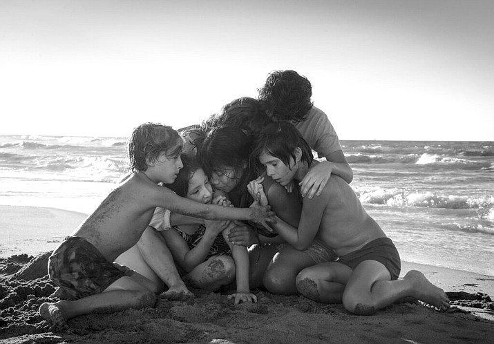 This image released by Netflix shows Yalitza Aparicio, center, in a scene from the film "Roma," by filmmaker Alfonso Cuaron. On Tuesday, Jan. 22, 2019, the film was nominated for an Oscar for both best foreign language film and best picture. The 91st Academy Awards will be held on Feb. 24. (Carlos Somonte/Netflix via AP)