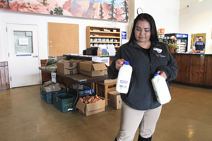 Serena Sloan, a resident of Grand Canyon and employee at Grand Canyon Conservancy visits the Food Pantry set up at the Grand Canyon Recreation Center. (Loretta Yerian/WGCN)