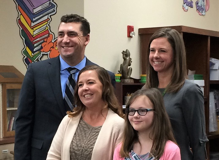 Superintendent Dan Streeter, left, and Granville Elementary School Principal Christine Griffin, right, award Ladawn Guest with the district’s VIP Classified Staff at the HUSD board meeting Jan. 8; also pictured is fifth-grader Allissa Fears, who nominated Guest. (Sue Tone/Tribune)