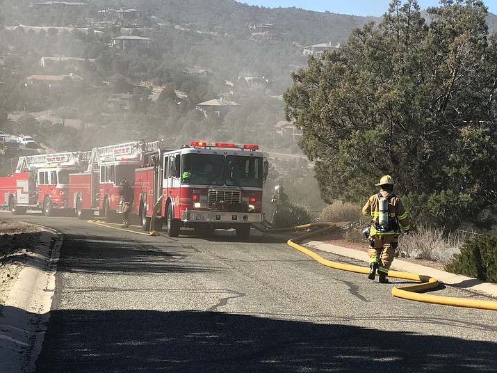 Seven fire engines line the 3100 block of Rainbow Ridge Dr. in Prescott in response to a home fire mid-day Tuesday, Jan. 22.