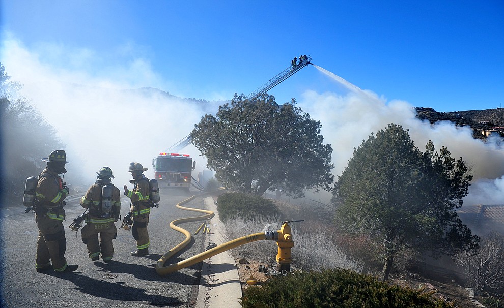 Prescott and Central Arizona and Chino Valley firefighters responded to a three-alarm structure fire in the 3000 block of Rainbow Ridge in the Ranch subdivision of Prescott Tuesday, Jan. 22, 2019. (Les Stukenberg/Courier).