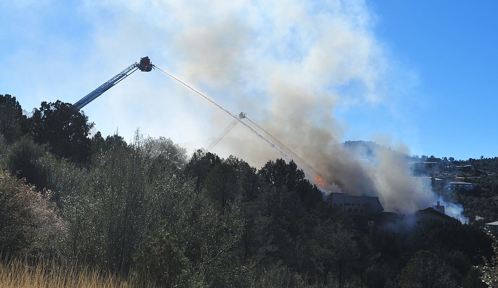 Prescott and Central Arizona and Chino Valley firefighters responded to a three-alarm structure fire in the 3000 block of Rainbow Ridge in the Ranch subdivision of Prescott Tuesday, Jan. 22, 2019. (Les Stukenberg/Courier).