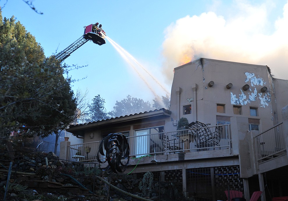 Prescott and Central Arizona and Chino Valley firefighters responded to a three-alarm structure fire in the 3000 block of Rainbow Ridge in the Ranch subdivision of Prescott Tuesday, Jan. 22, 2019. (Les Stukenberg/Courier).