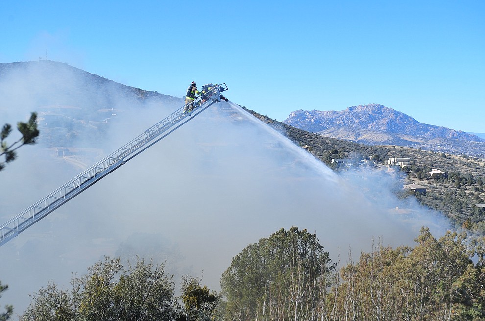 Prescott and Central Arizona and Chino Valley firefighters responded to a three-alarm structure fire in the 3000 block of Rainbow Ridge in the Ranch subdivision of Prescott Tuesday, Jan. 22, 2019. (Les Stukenberg/Courier).