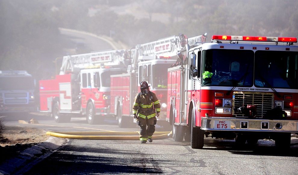 Prescott and Central Arizona and Chino Valley firefighters responded to a three-alarm structure fire in the 3000 block of Rainbow Ridge in the Ranch subdivision of Prescott Tuesday, Jan. 22, 2019. (Les Stukenberg/Courier).