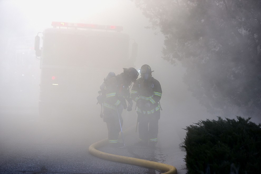 Prescott and Central Arizona and Chino Valley firefighters responded to a three-alarm structure fire in the 3000 block of Rainbow Ridge in the Ranch subdivision of Prescott Tuesday, Jan. 22, 2019. (Les Stukenberg/Courier).