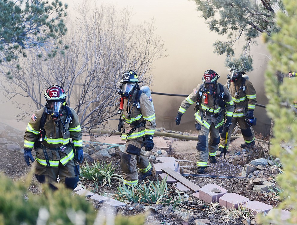 Prescott and Central Arizona and Chino Valley firefighters responded to a three-alarm structure fire in the 3000 block of Rainbow Ridge in the Ranch subdivision of Prescott Tuesday, Jan. 22, 2019. (Les Stukenberg/Courier).