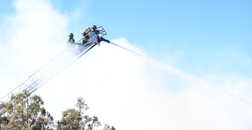 Prescott and Central Arizona and Chino Valley firefighters responded to a three-alarm structure fire in the 3000 block of Rainbow Ridge in the Ranch subdivision of Prescott Tuesday, Jan. 22, 2019. (Les Stukenberg/Courier).