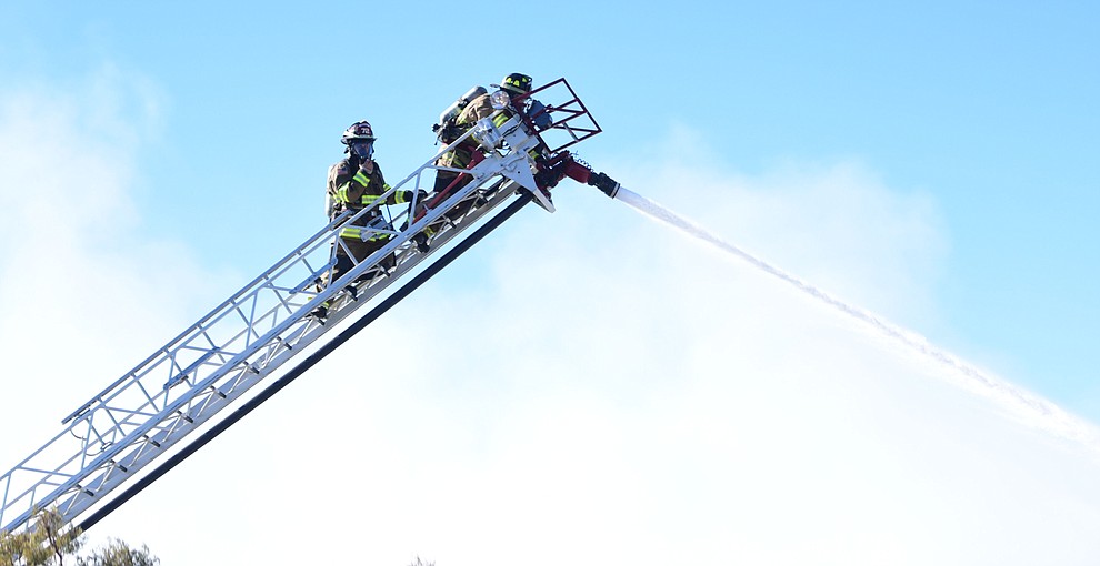 Prescott and Central Arizona and Chino Valley firefighters responded to a three-alarm structure fire in the 3000 block of Rainbow Ridge in the Ranch subdivision of Prescott Tuesday, Jan. 22, 2019. (Les Stukenberg/Courier).