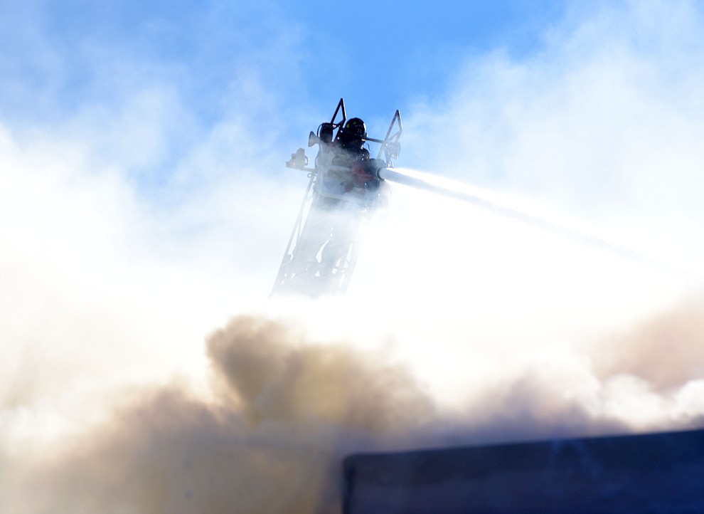 Prescott and Central Arizona and Chino Valley firefighters responded to a three-alarm structure fire in the 3000 block of Rainbow Ridge in the Ranch subdivision of Prescott Tuesday, Jan. 22, 2019. (Les Stukenberg/Courier).