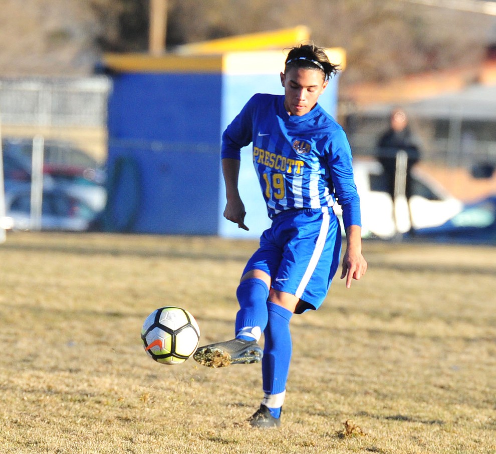Prescott's Bryce Costes sends the ball upfield as the Badgers take on the Coconino Panthers Wednesday, Jan. 23, 2019 in Prescott. (Les Stukenberg/Courier).
