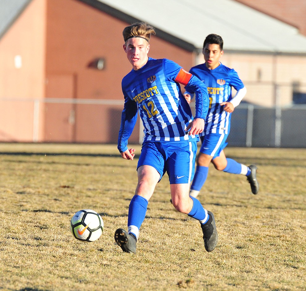 Prescott's Brayden Nelson passes the ball forward as the Badgers take on the Coconino Panthers Wednesday, Jan. 23, 2019 in Prescott. (Les Stukenberg/Courier).