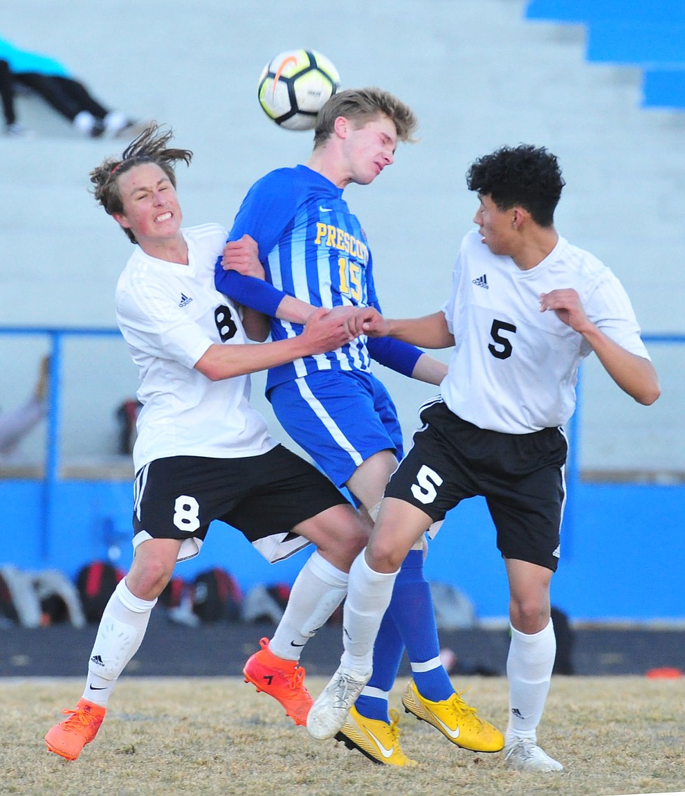 Prescott's Spencer Hewitt heads the ball on a corner kick as the Badgers take on the Coconino Panthers Wednesday, Jan. 23, 2019 in Prescott. (Les Stukenberg/Courier).