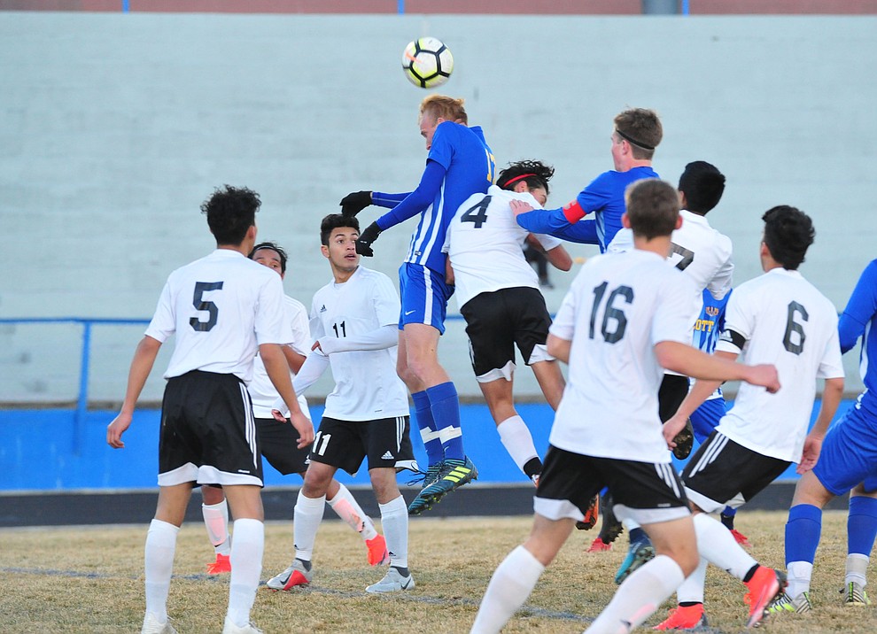 Prescott's Ryan Doyle heads the ball off a corner kick as the Badgers take on the Coconino Panthers Wednesday, Jan. 23, 2019 in Prescott. (Les Stukenberg/Courier).