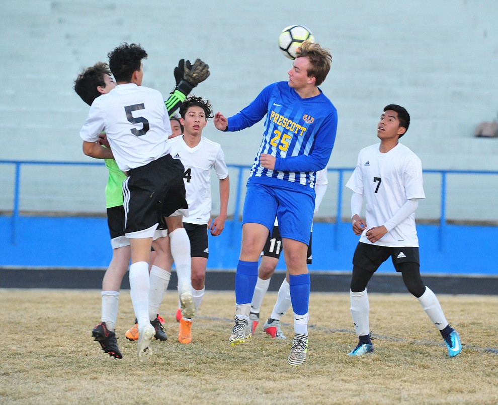 Prescott's Jack Gould heads the ball towards the goal as the Badgers take on the Coconino Panthers Wednesday, Jan. 23, 2019 in Prescott. (Les Stukenberg/Courier).