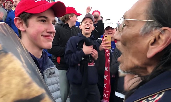 A student from Covington Catholic high school standing in front of Native American Vietnam veteran Nathan Phillips in Washington DC on 18 January. (Photograph: Social Media/Reuters)