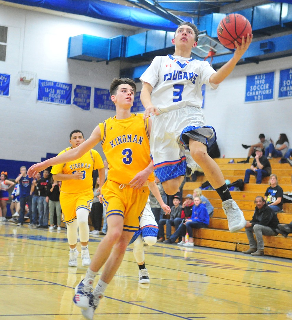 Chino Valley's Kamren Loftin gies airborne for two-points as they face the Kingman Bulldogs Thursday, Jan. 24, 2019 in Chino Valley. (Les Stukenberg/Courier).