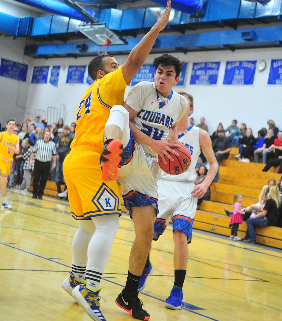 Chino Valley's Daniel Martinez grabs a rebound as they face the Kingman Bulldogs Thursday, Jan. 24, 2019 in Chino Valley. (Les Stukenberg/Courier).