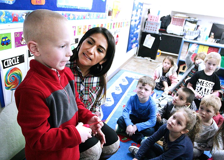 Lizette Farraro, an assistant preschool teacher at Verde Christian Academy, watches as five-year-old Lucas Shires addresses his fellow classmates. The school’s preschool program recently was recognized by Quality First with a five-star rating. VVN/Bill Helm