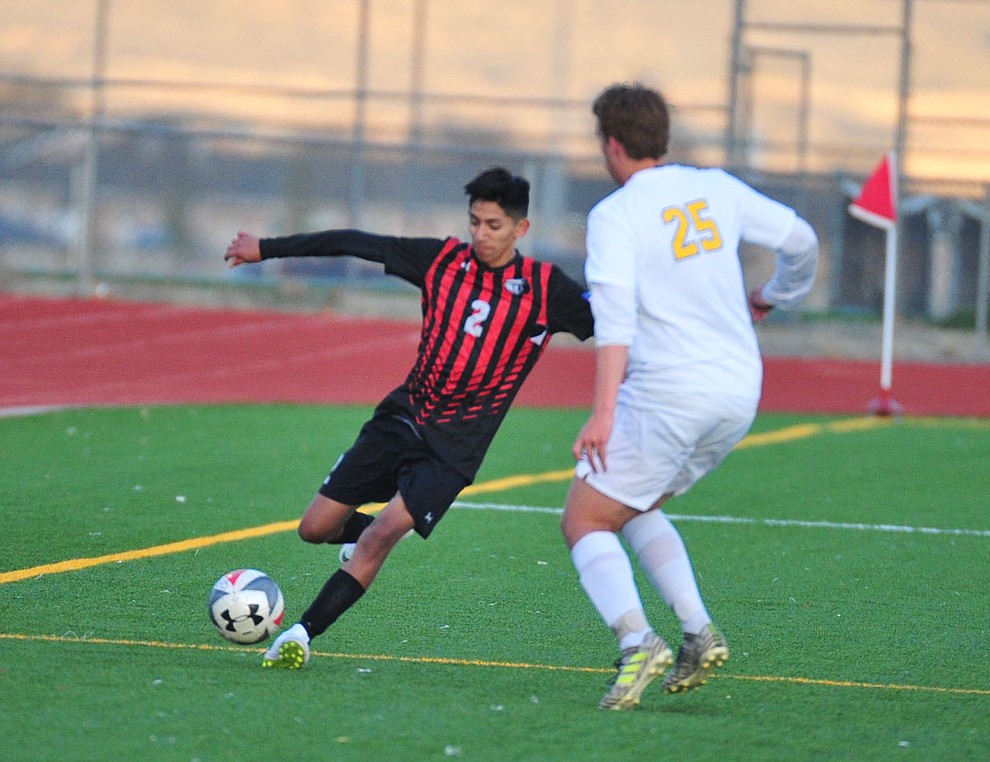 Bradshaw Mountain's AJ Villafana passes the ball around Prescott's Jack Gould as the Bears play the Prescott Badgers Tuesday, Jan. 29, 2019 in Prescott Valley. (Les Stukenberg/Courier).