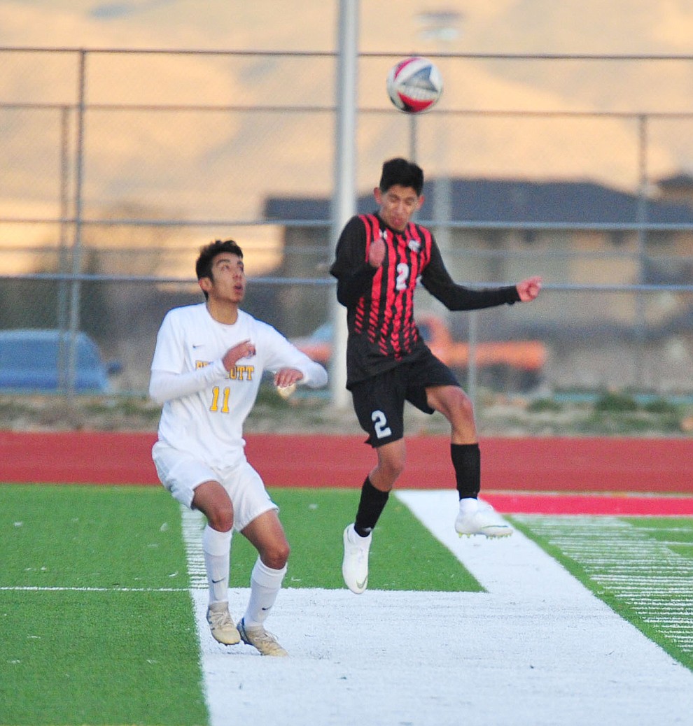 Bradshaw Mountain's AJ Villafana heads the ball as the Bears play the Prescott Badgers Tuesday, Jan. 29, 2019 in Prescott Valley. (Les Stukenberg/Courier).