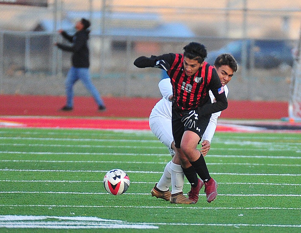 Bradshaw Mountain's Geo De Los Santos dives to the ball as the Bears play the Prescott Badgers Tuesday, Jan. 29, 2019 in Prescott Valley. (Les Stukenberg/Courier).