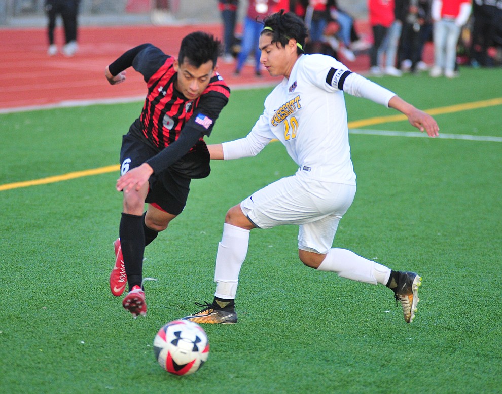Bradshaw Mountain's Ruben Gonzalez moves the ball around Prescott's Carlos Rivera as the Bears play the Prescott Badgers Tuesday, Jan. 29, 2019 in Prescott Valley. (Les Stukenberg/Courier).