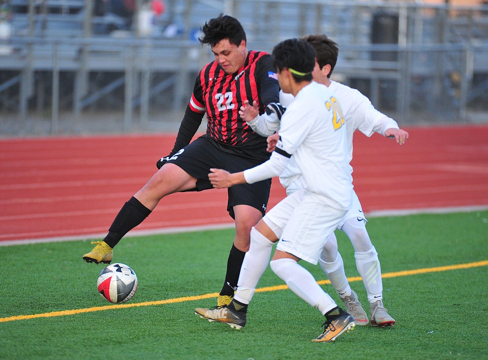 Bradshaw Mountain's Geri Sotelo fights for the ball with two defenders as the Bears play the Prescott Badgers Tuesday, Jan. 29, 2019 in Prescott Valley. (Les Stukenberg/Courier).