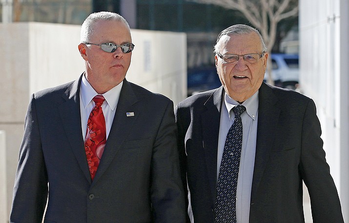 In this Jan. 25, 2017 file photo, former Maricopa County Sheriff Joe Arpaio, right, is showing leaving federal court in downtown Phoenix with his former chief deputy, Jerry Sheridan. Investigators concluded in a report released Monday, Jan. 28, 2019 that Sheridan had violated policies requiring him to be truthful in his job when claiming that he didn't know about a judge's order that Arpaio had famously disobeyed until two years after it was issued. (Ross D. Franklin/AP, file)
