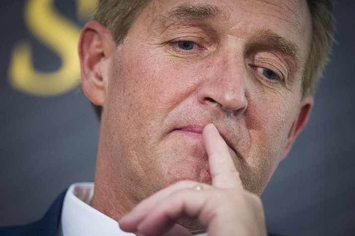 In this Oct. 2, 2018 file photo Sen. Jeff Flake, R-Ariz. participates in a forum in Washington. Flake says he hopes a Republican will challenge President Donald Trump’s re-election bid, but it won’t be him. (Cliff Owen/AP, file)