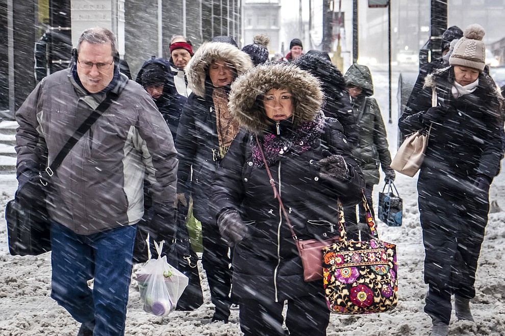 Morning commuters face a tough slog on Wacker Drive in Chicago, Monday, Jan. 28, 2019. (Rich Hein/Chicago Sun-Times via AP)