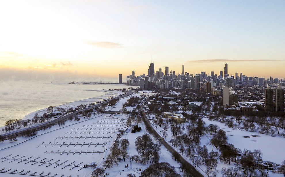 Chicago's lakefront is covered with ice on Wednesday, Jan. 30, 2019. Temperatures are plummeting in Chicago as officials warn against venturing out into the dangerously cold weather. (AP Photo/Teresa Crawford)
