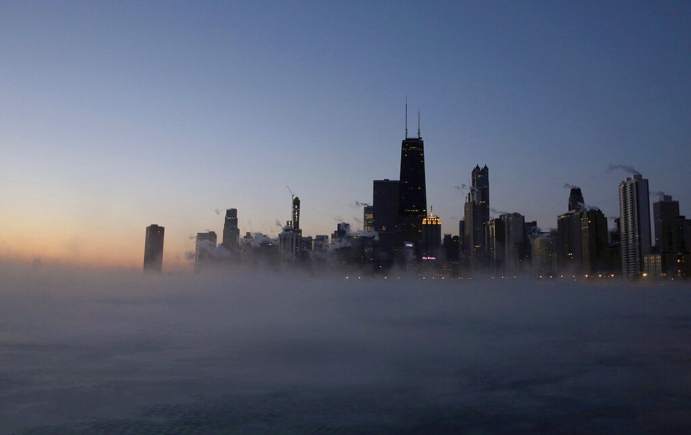 Steam rises up on the surface of Lake Michigan, Wednesday, Jan. 30, 2019, in Chicago. A deadly arctic deep freeze enveloped the Midwest with record-breaking temperatures on Wednesday, triggering widespread closures of schools and businesses, and prompting the U.S. Postal Service to take the rare step of suspending mail delivery to a wide swath of the region. (AP Photo/Kiichiro Sato)