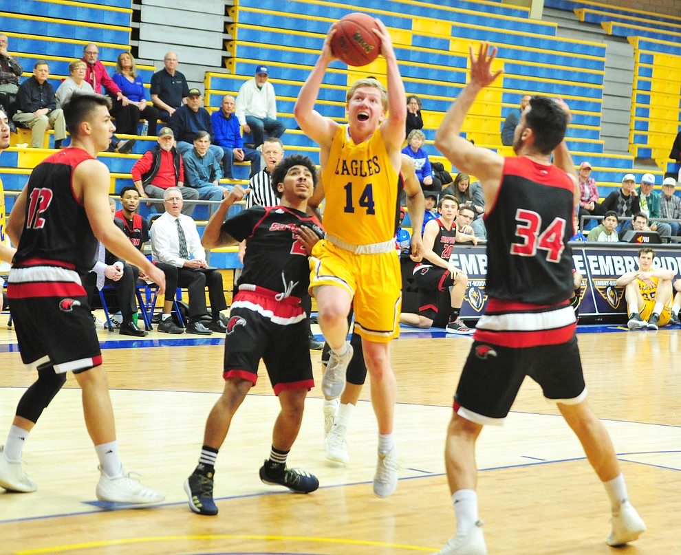 Embry Riddle's Kaden Herbert cuts between a trio of defenders as the Eagles take on the Simpson University Redhawks Thursday, Jan. 31, 2019 in Prescott. (Les Stukenberg/Courier).