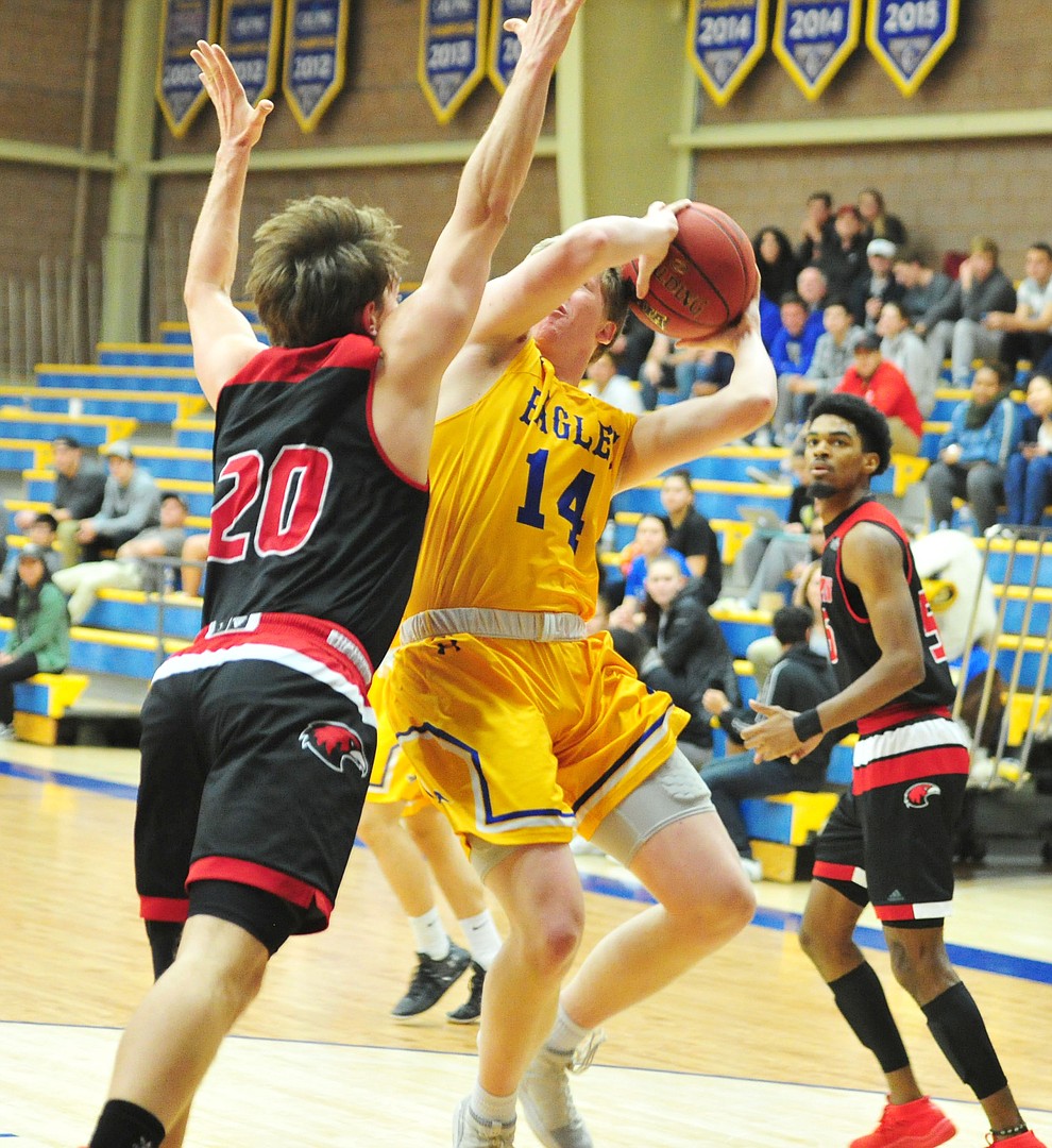 Embry Riddle's Kaden Herbert gets fouled while shooting as the Eagles take on the Simpson University Redhawks Thursday, Jan. 31, 2019 in Prescott. (Les Stukenberg/Courier).