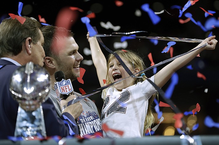 New England Patriots’ Tom Brady holds his daughter Vivian, after the NFL Super Bowl 53 football game against the Los Angeles Rams, Sunday, Feb. 3, 2019, in Atlanta. The Patriots won 13-3. (Carolyn Kaster/AP)