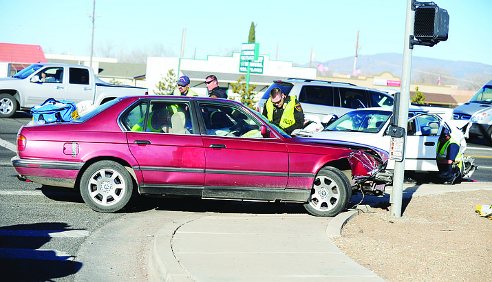 A two-vehicle collision at the intersection of Robert Road and Highway 69 on Jan. 3, 2013, in Prescott Valley. Arizona motorists who purchase just the bare minimum liability insurance now required could be forced to spend more — if Gov. Doug Ducey goes along. (Les Stukenberg/Courier, file)
