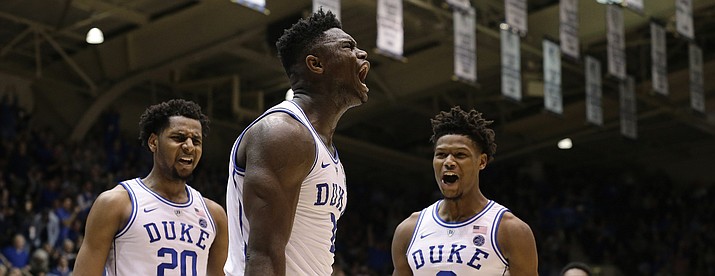 Duke's Zion Williamson, center, reacts with Marques Bolden (20), Cam Reddish (2) and RJ Barrett (5) following a play against St. John's during the second half of an NCAA college basketball game in Durham, N.C., Saturday, Feb. 2, 2019. Duke won 91-61. (Gerry Broome/AP)