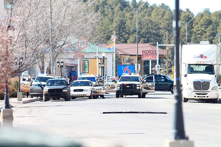 Law enforcement surround a suicidal suspect who barricaded himself in his vehicle Jan. 30 in Williams. (Loretta Yerian/WGCN)