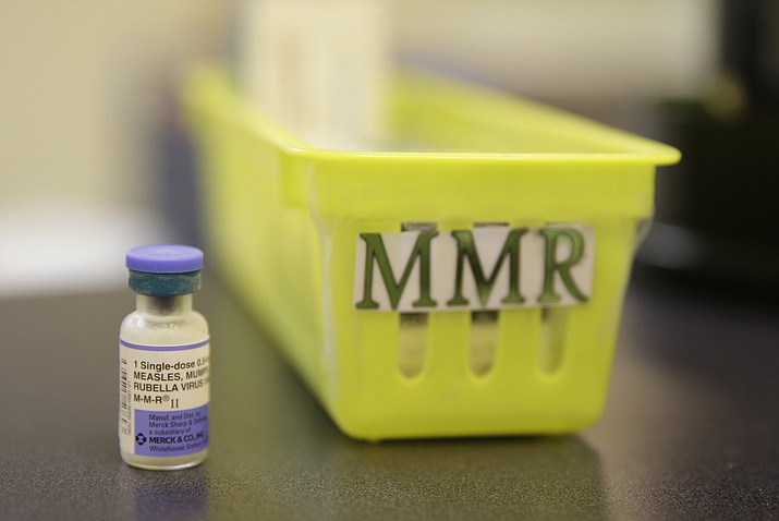 This Feb. 6, 2015, file photo, shows a measles, mumps and rubella vaccine on a countertop at a pediatrics clinic in Greenbrae, California. A measles outbreak near Portland, Oregon, has revived a bitter debate over so-called “philosophical” exemptions to childhood vaccinations as public health officials across the Pacific Northwest scramble to limit the fallout from the disease. On Jan. 25, Washington Gov. Jay Inslee declared a state of emergency because of the outbreak. (AP Photo/Eric Risberg, File)